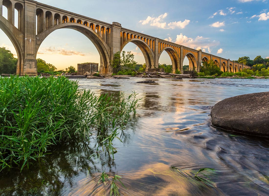Blog - Scenic View of a Railroad Bridge Next to the River at Sunset in Richmond Virginia